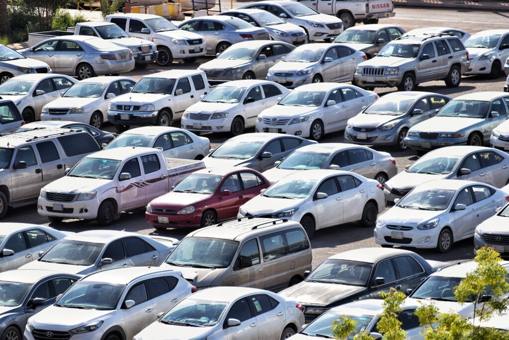 A parking lot full of vehicles showing the importance of installing a tracker for your car
